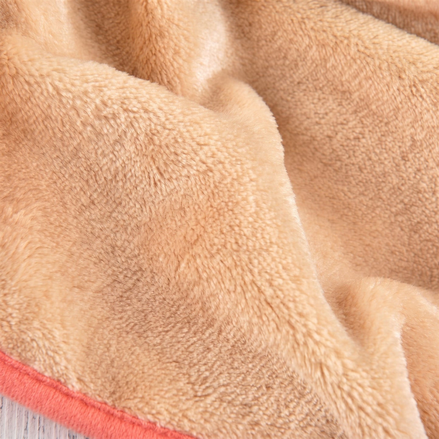 Close-up of the soft, plush beige interior lining of the CozyCloud dog jumpsuit.