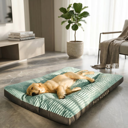 A golden retriever puppy sleeping peacefully on a green Nordic Slumber washable removable bed, branded "Pet Heaven".