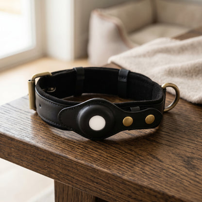 Nordic Guardian premium black leather dog collar on a wooden surface.