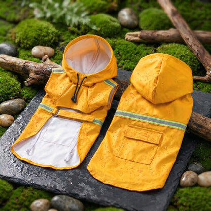Yellow waterproof dog raincoats with reflective strips and hoods, displayed on a natural mossy surface with branches.