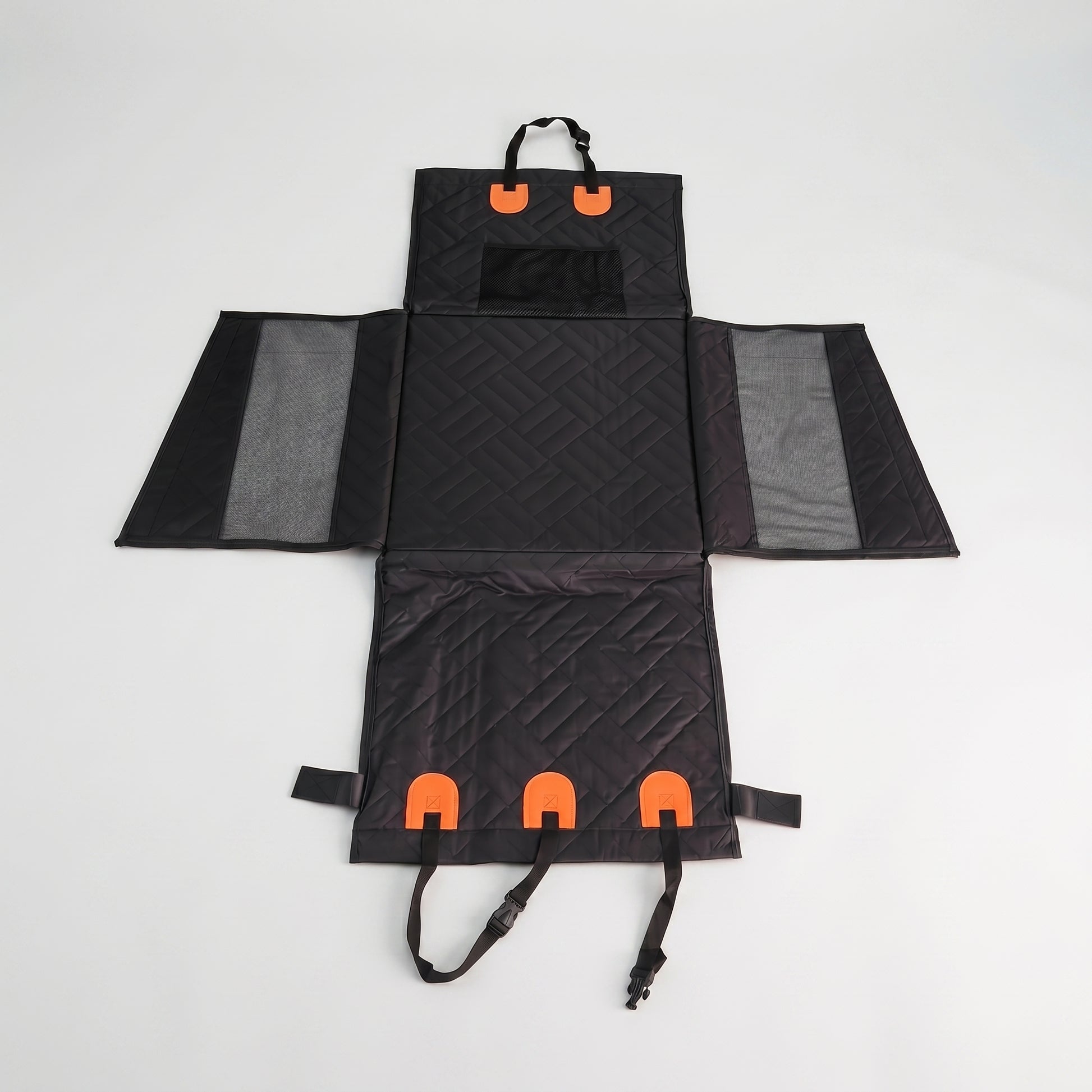 Flat-lay view of the Nordic Cloud waterproof travel bed fully unfolded, displaying the multi-panel design, mesh sides, and orange fastening straps.