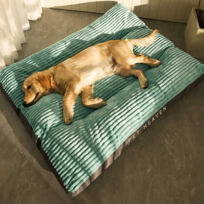 A golden retriever puppy sleeping peacefully on a green Nordic Slumber washable removable bed, branded "Pet Heaven".