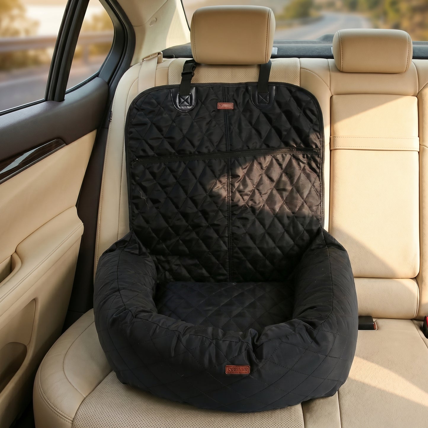 Grey Nordic Throne Luxury Car Pet Suite installed in a car backseat.