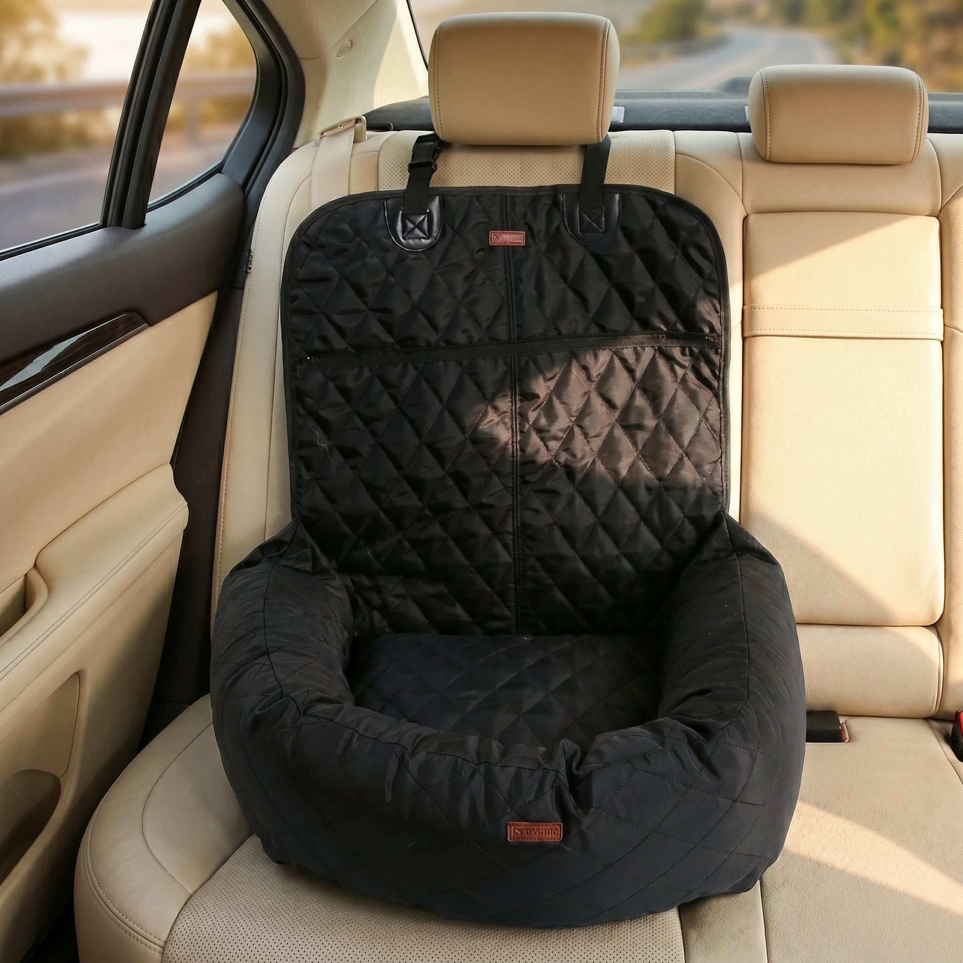 Grey Nordic Throne Luxury Car Pet Suite installed in a car backseat.
