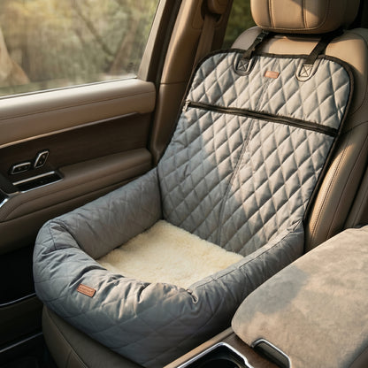 Nordic Throne Luxury Car Pet Suite installed in the back seat of a vehicle, featuring a quilted design.